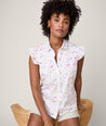 Model is wearing UNTUCKit White with Floral Print Anne Shirt.
