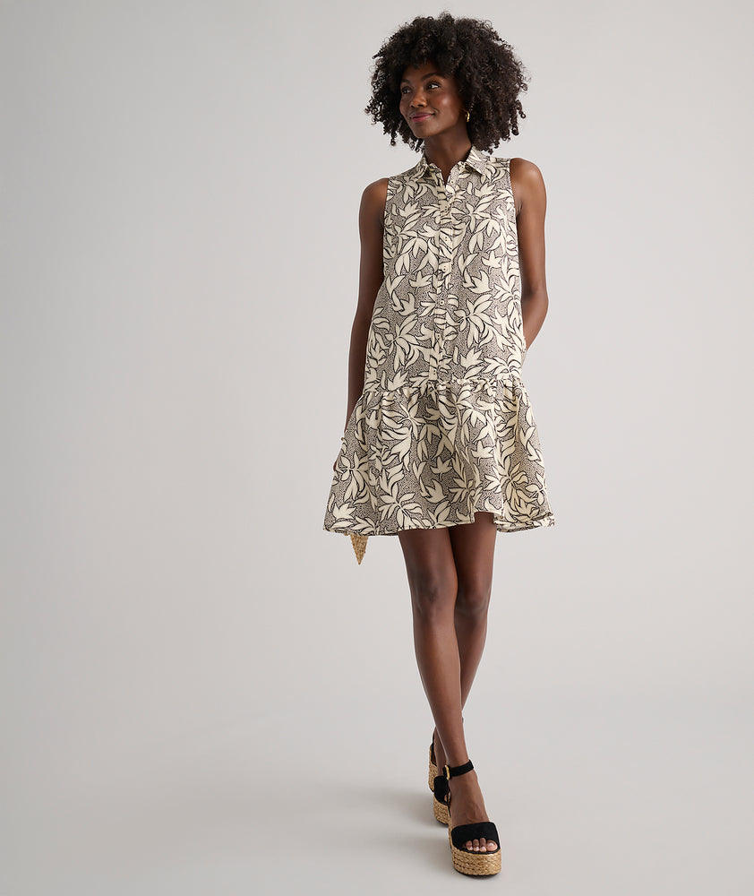 Model is wearing UNTUCKit Amara dress in floral tan print.