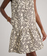 Model is wearing UNTUCKit Amara dress in floral tan print.