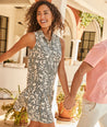 Model is wearing UNTUCKit Amara dress in floral tan print.