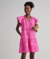Model is wearing UNTUCKit Arya dress in pink print.