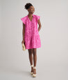 Model is wearing UNTUCKit Arya dress in pink print.