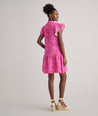 Model is wearing UNTUCKit Arya dress in pink print.