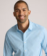 Model is wearing UNTUCKit Ashbourne cottentek shirt in checkered blue. 