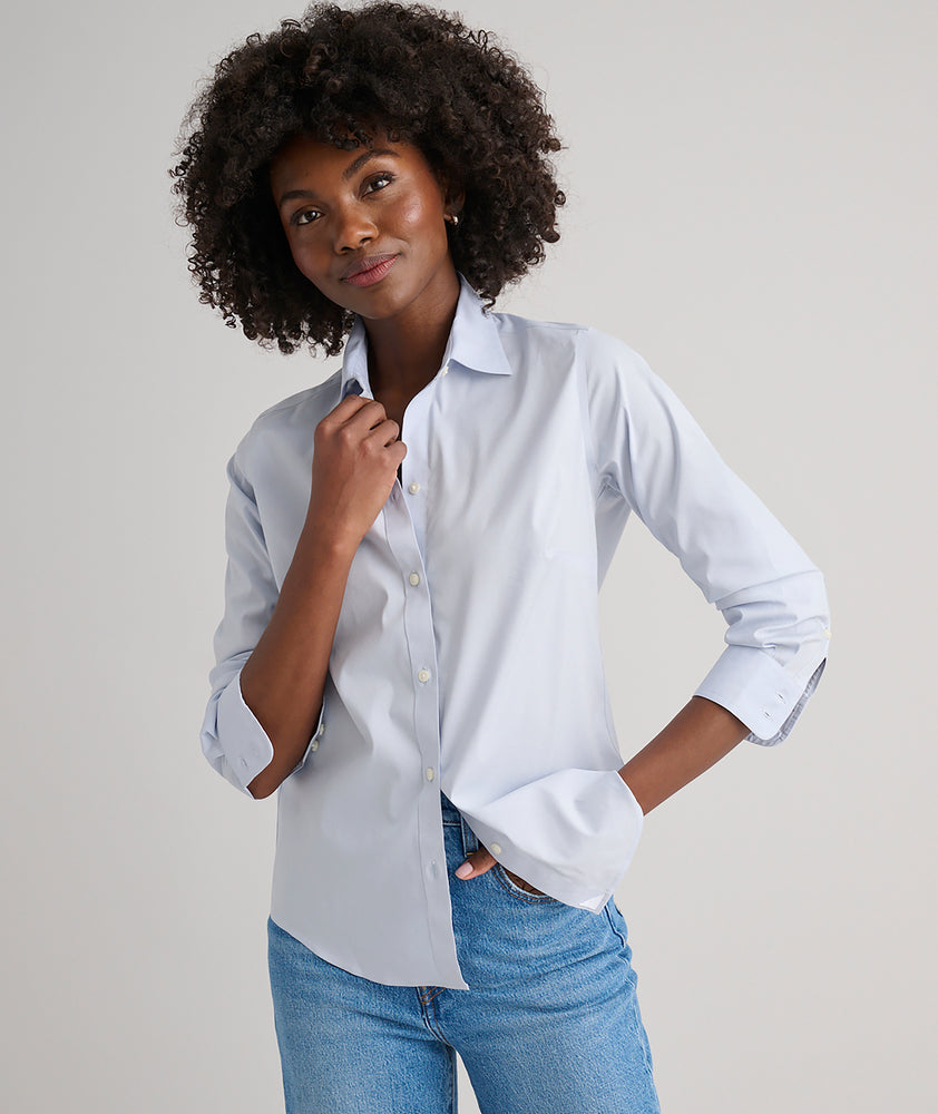Model is wearing UNTUCKit Bella shirt in blue. 