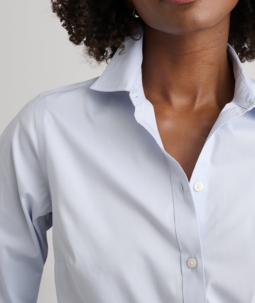 Model is wearing UNTUCKit Bella shirt in blue. 