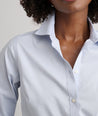 Model is wearing UNTUCKit Bella shirt in blue. 