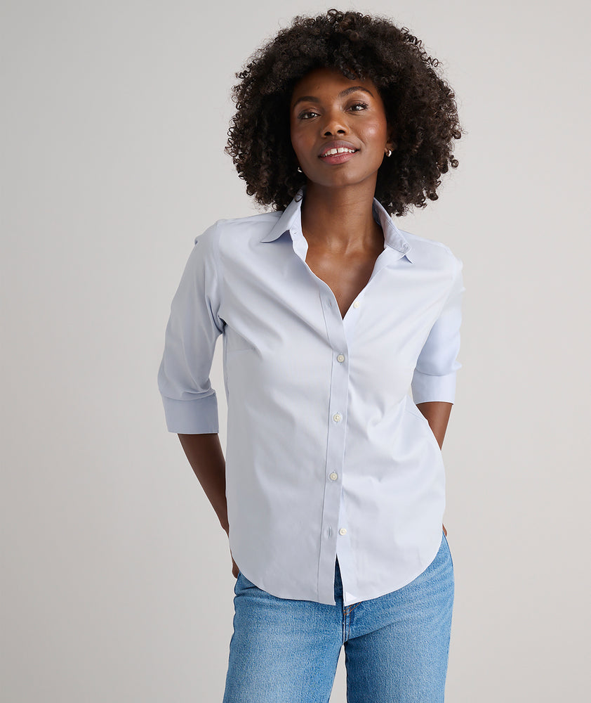 Model is wearing UNTUCKit Bella shirt in blue. 
