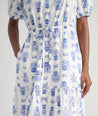 Model is wearing UNTUCKit Brigitte dress in floral white print. 