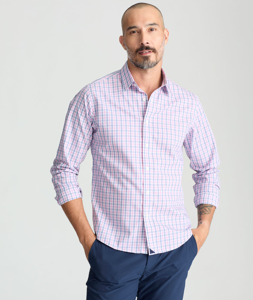 Model is wearing UNTUCKit dolcetto wrinkle free button down.