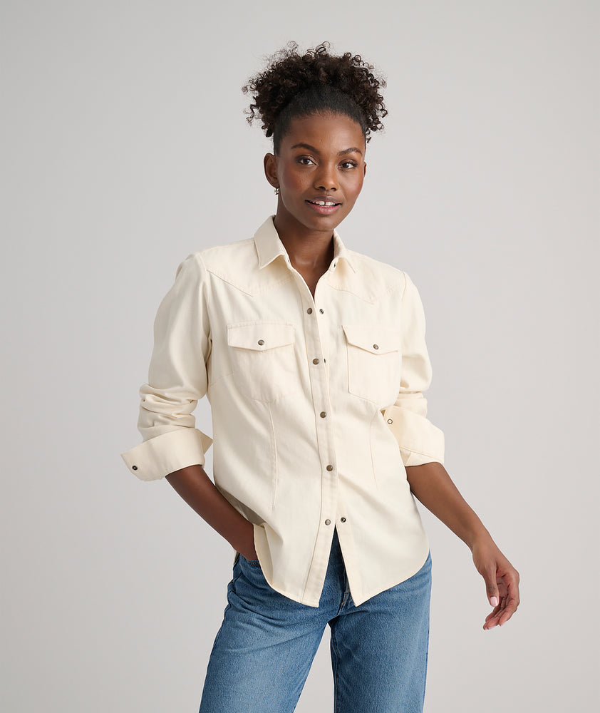 Model is wearing UNTUCKit Dolly shirt in Ecru.