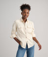 Model is wearing UNTUCKit Dolly shirt in Ecru.