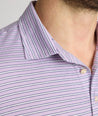 Model is wearing UNTUCKit Fernandez polo in lavender. 