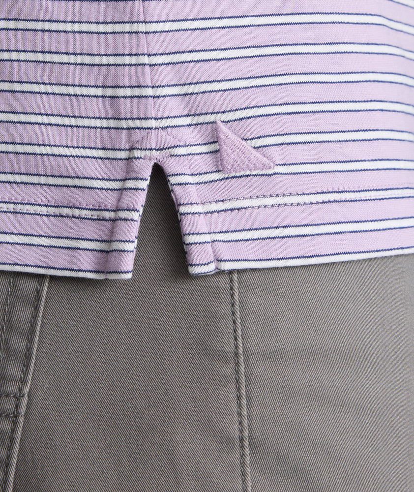 Model is wearing UNTUCKit Fernandez polo in lavender. 