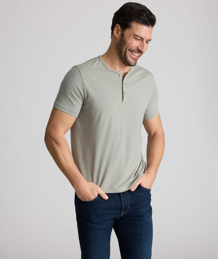 Model wearing an UNTUCKit Military Green Essential Henley in EcoSoft™.