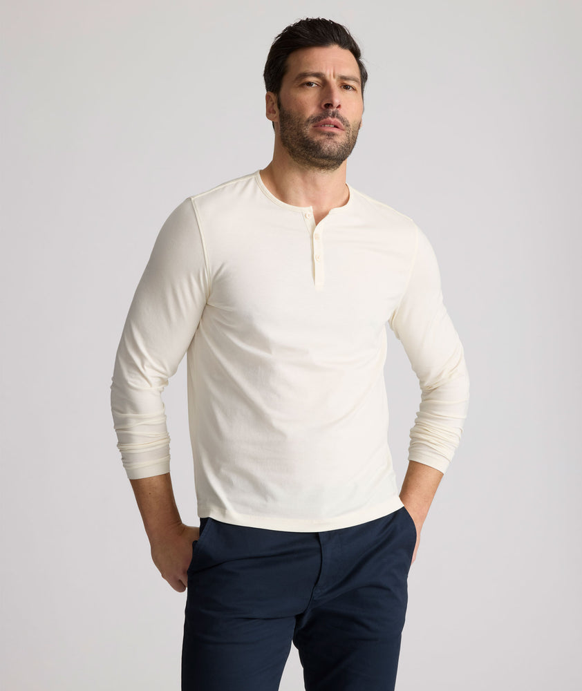 Model is wearing UNTUCKit Marastina henley in Vanilla Ice.