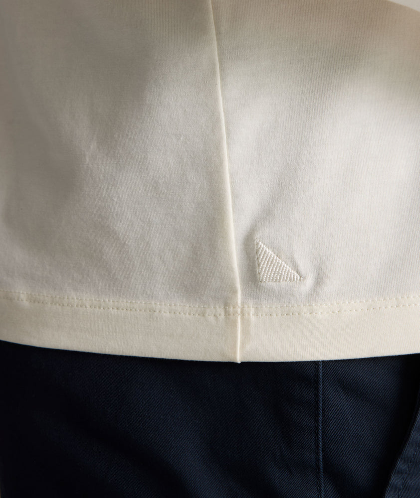 Model is wearing UNTUCKit Marastina henley in Vanilla Ice.
