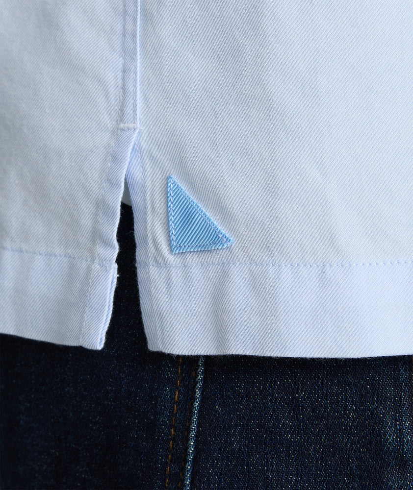 Model is wearing UNTUCKit Hughes in light blue. 