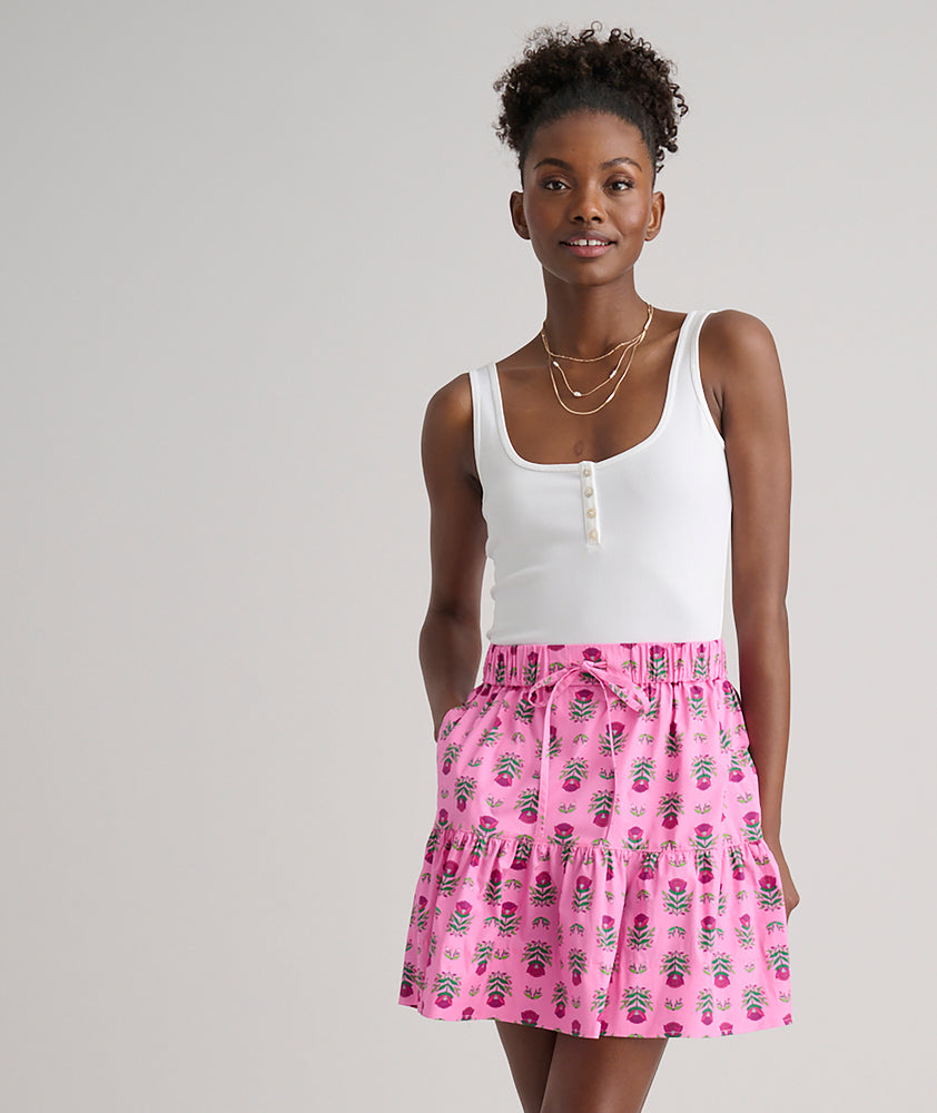 Model is wearing UNTUCKit Ilona skirt in pink. 