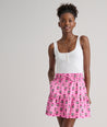 Model is wearing UNTUCKit Ilona skirt in pink. 
