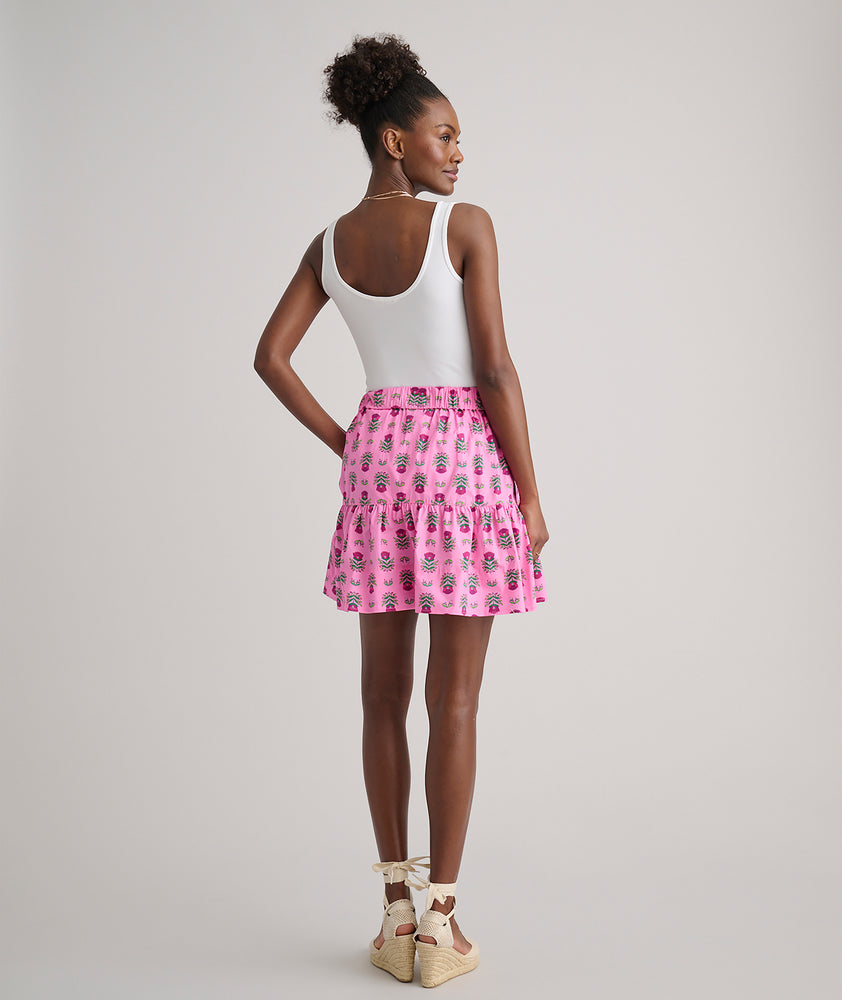 Model is wearing UNTUCKit Ilona skirt in pink. 