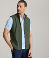 Model is wearing UNTUCKit Inman performance vest in green.