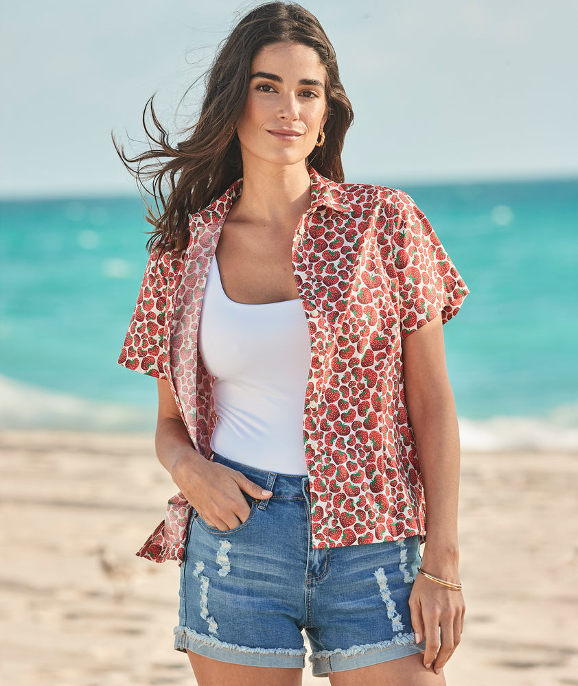 Model is wearing UNTUCKit Jamie shirt in strawberry print. 