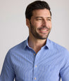 Model is wearing UNTUCKit Kelly wrinkle free shirt in blue gingham.