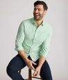Model is wearing UNTUCKit Kelly wrinkle free shirt in green gingham.