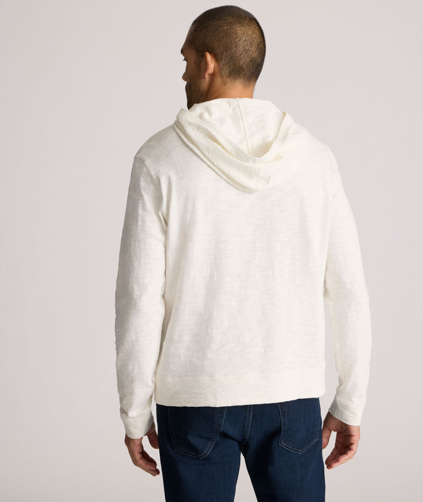 Model is wearing UNTUCKit Slub Cotton Hoodie in Off-White egret.
