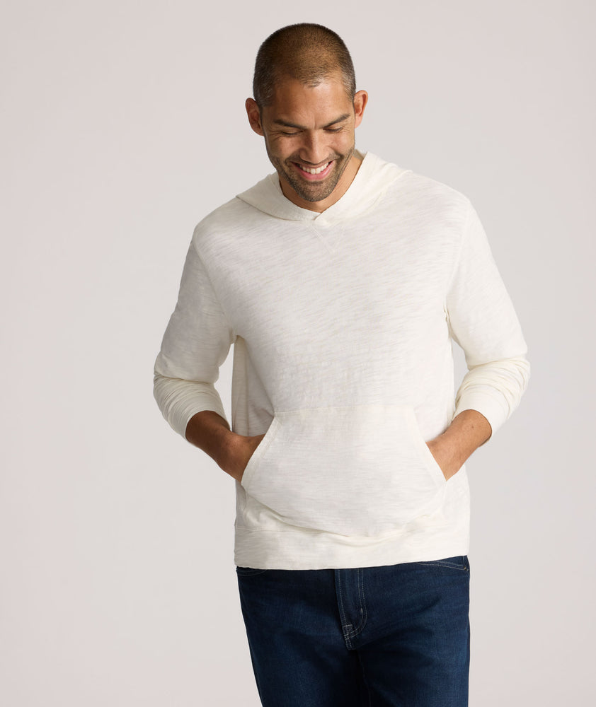 Model is wearing UNTUCKit Slub Cotton Hoodie in Off-White egret.