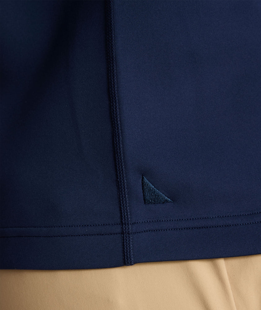 Model is wearing UNTUCKit performance sweatshirt in navy.