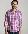 Model is wearing UNTUCKit rafferty shirt in plaid red. 