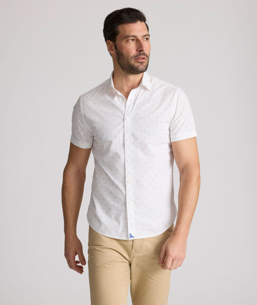 Model is wearing UNTUCKit Rockwell short sleeve cotton shirt. 