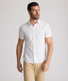 Model is wearing UNTUCKit Rockwell short sleeve cotton shirt. 