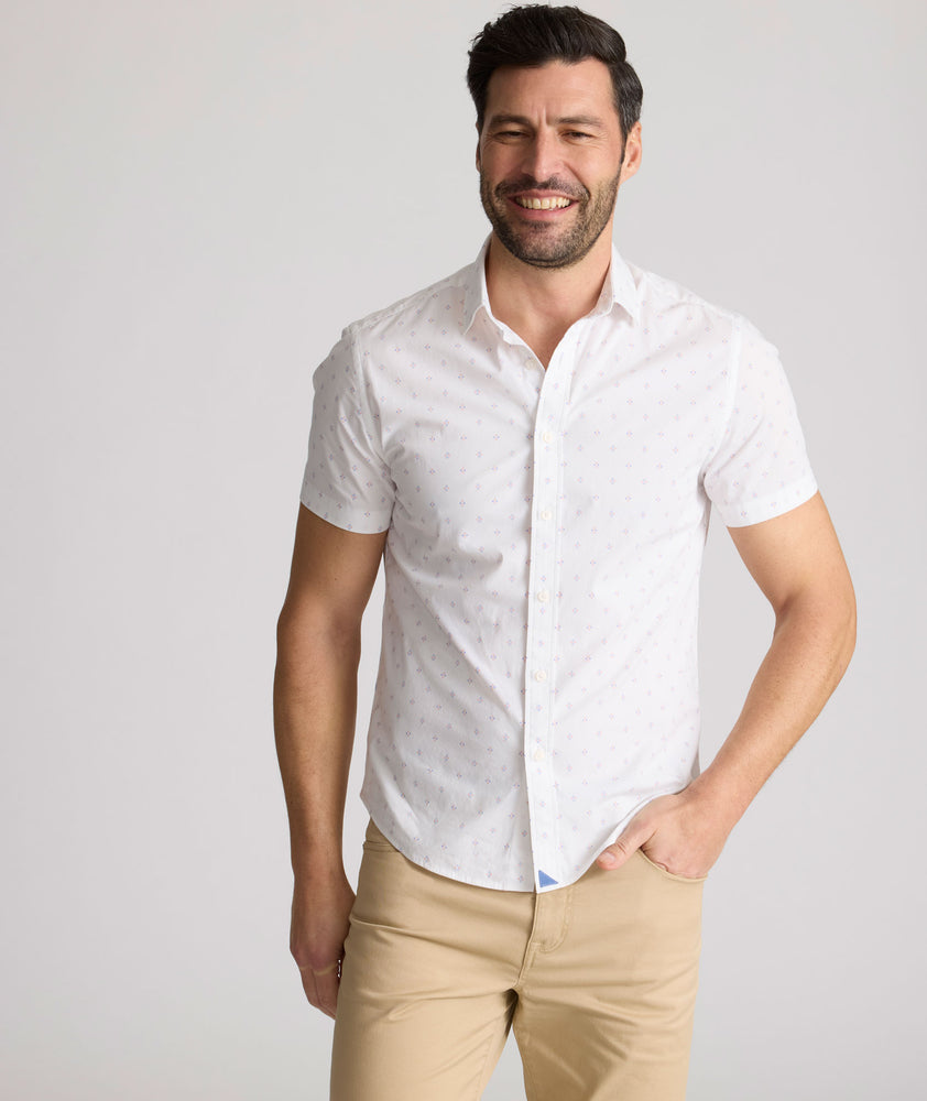 Model is wearing UNTUCKit Rockwell short sleeve cotton shirt. 