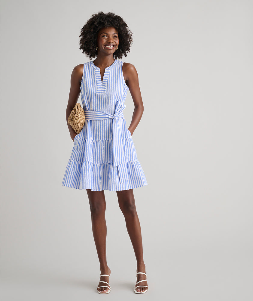 Model is wearing UNTUCKit Roxanne blue stripped dress. 
