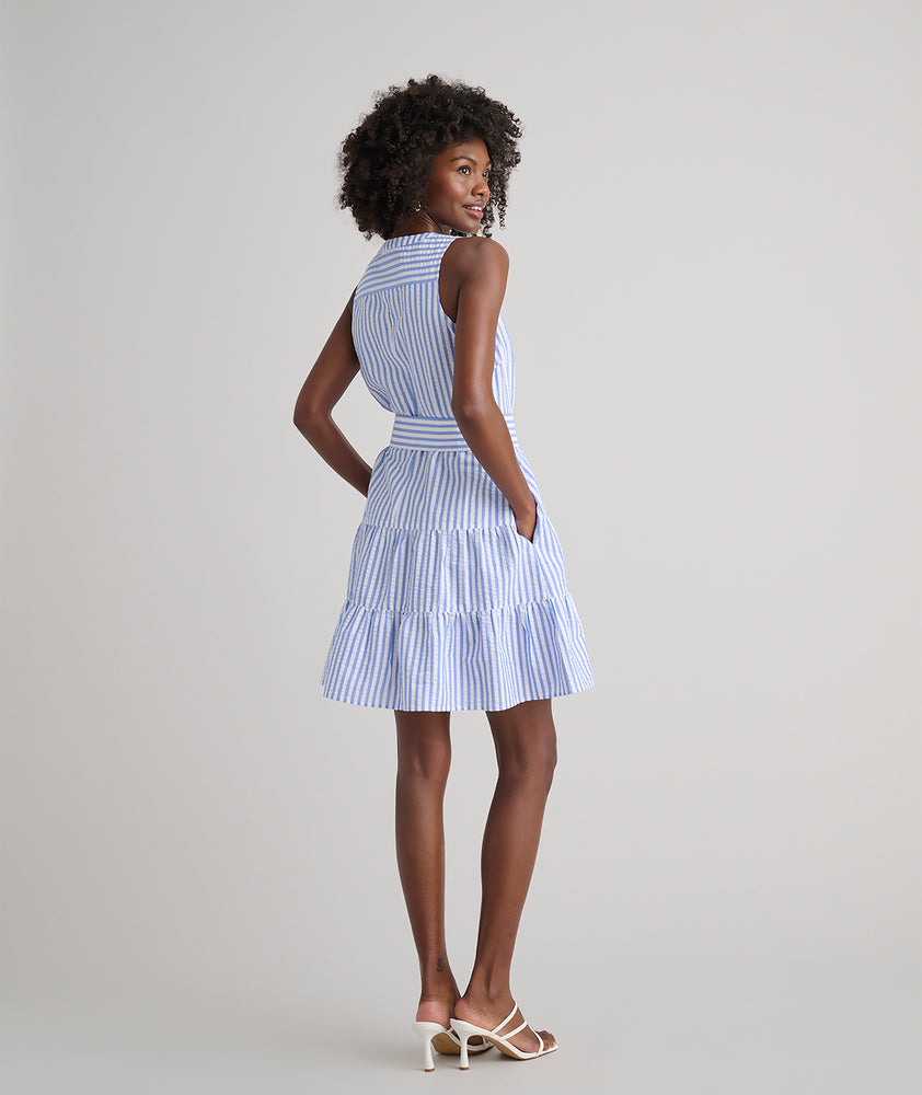 Model is wearing UNTUCKit Roxanne blue stripped dress. 