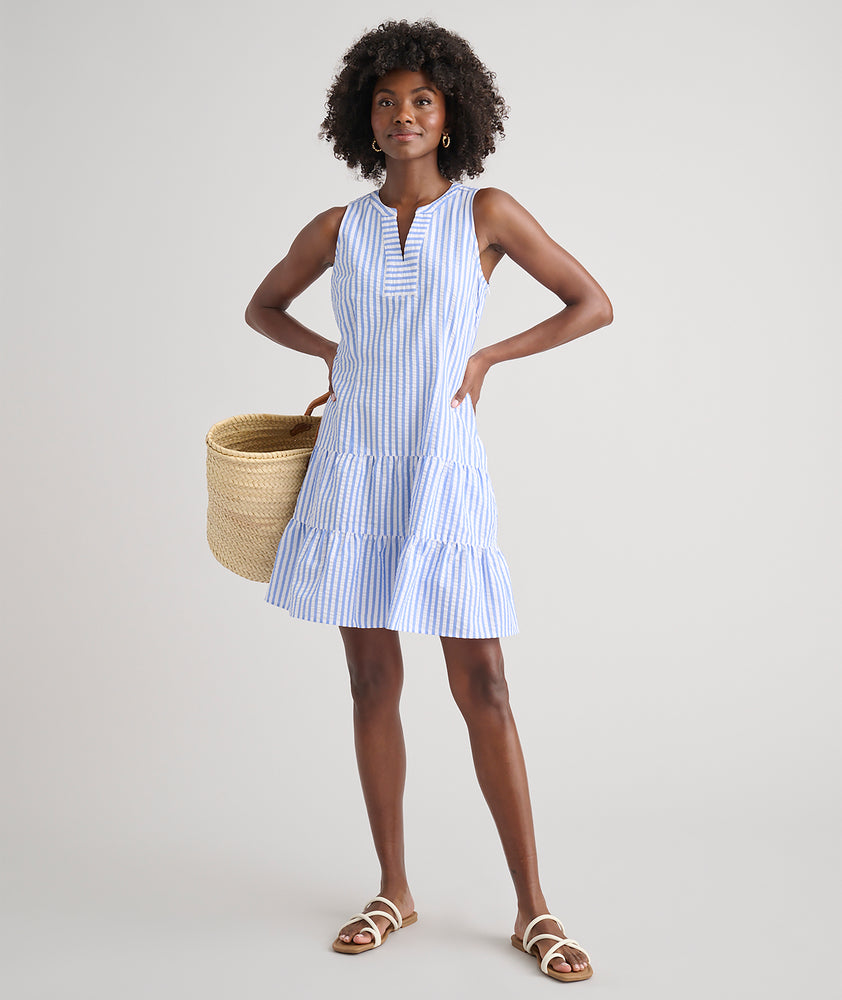 Model is wearing UNTUCKit Roxanne blue stripped dress. 