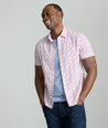 Model is wearing UNTUCKit Sanchez short sleeve shirt in pink.
