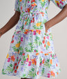 Model is wearing UNTUCKit Sierra dress in fruit print.
