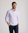 Model is wearing UNTUCKit trembley cottontek orange check shirt. 